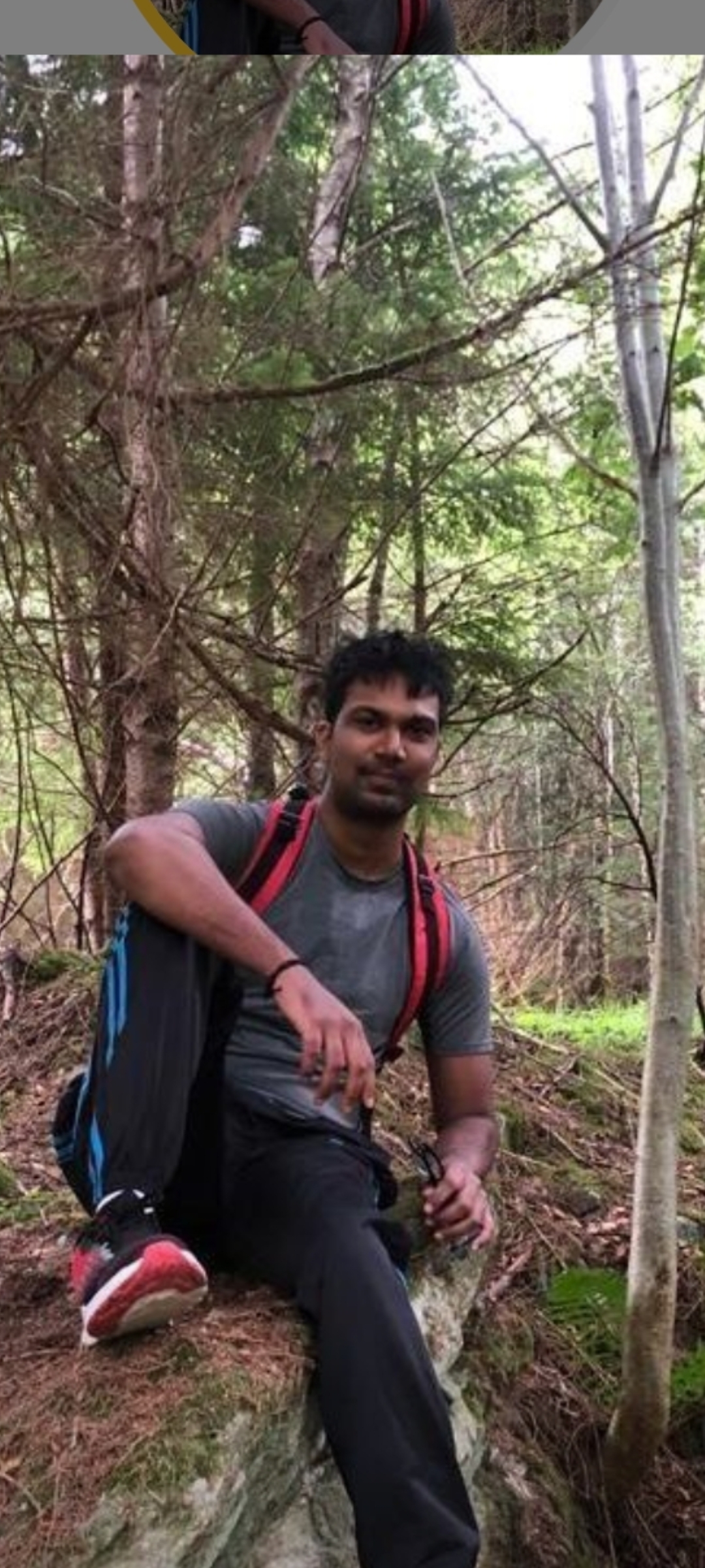 Sukkrivaa taking a rest while hiking in woodland